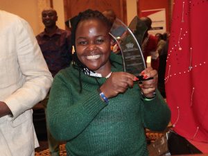 Girl Child Network: How we got Uhuru to enact Disability law and trailblazing policy reform Girl Child Network staff member hold the NGO Award they won in the Disability Inclusion category
