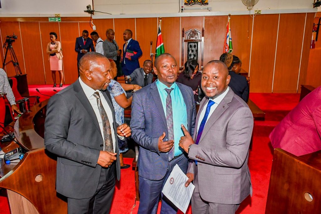 Bunge Mashinani Executive Director Michael Mburu (right) and others at the Kiambu county assembly.