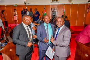 Bunge Mashinani Executive Director Michael Mburu (right) and others at the Kiambu county assembly.